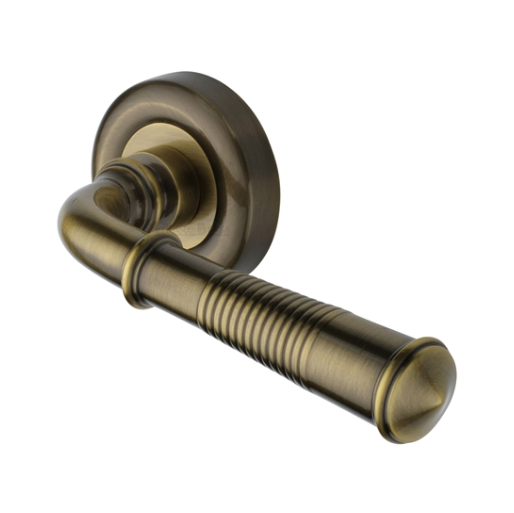Colonial Reeded Door Handle on Round Rose - Antique Brass